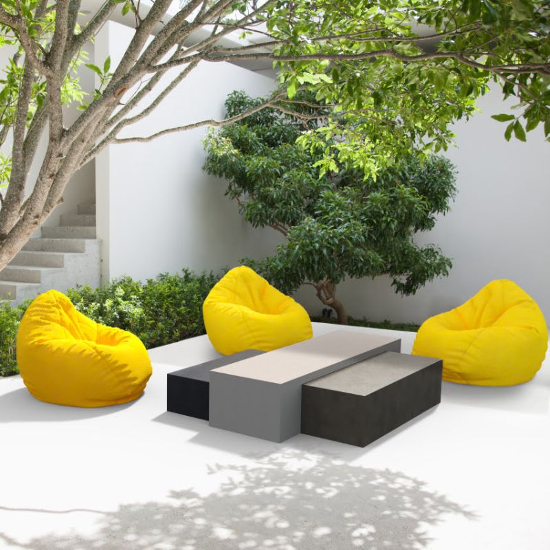 Bloc L3 Concrete Coffee Table in a Garden